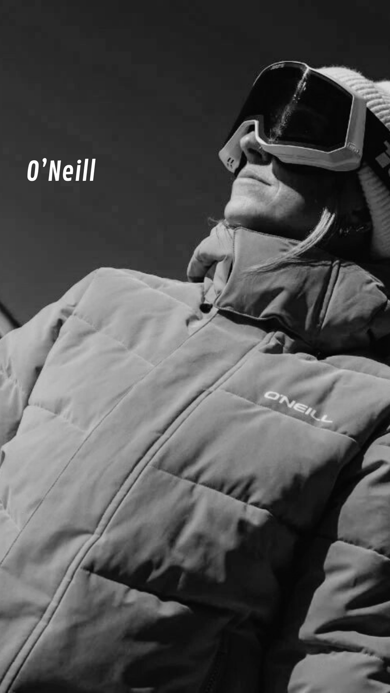 Person wearing a O'Neill jacket with goggles on a mountain background - urbaneight