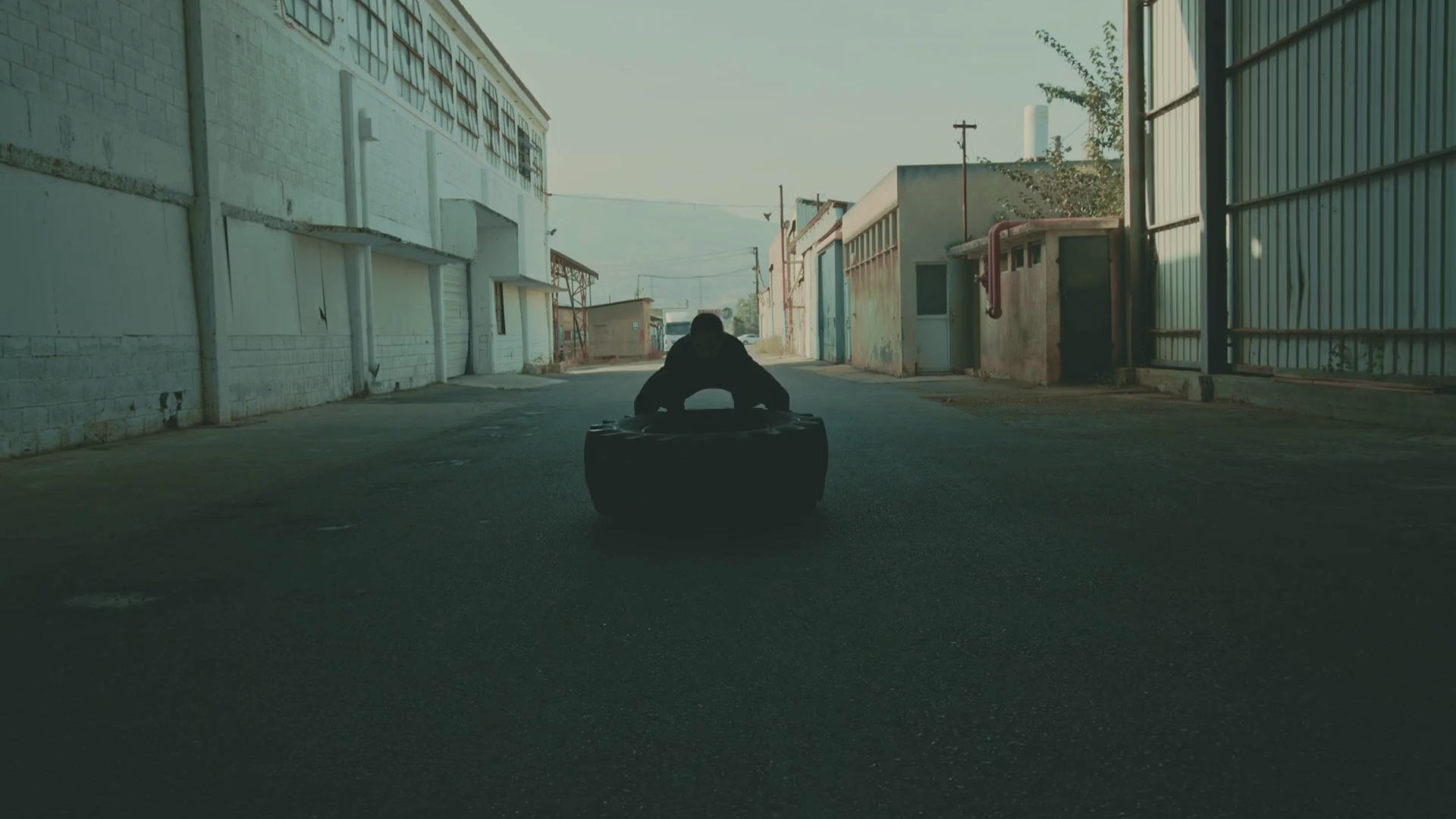 hyrox athlete pushing a tire - urbaneight
