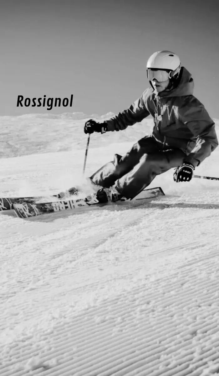 Person skiing on a snowy slope with 'Rossignol' branding.